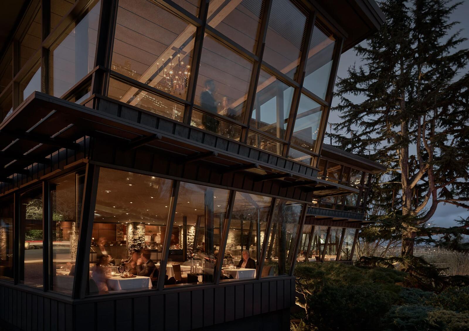 Canlis in Seattle beneath evergreen trees